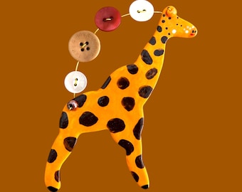 Handmade Ceramic Giraffe Decoration with buttons .