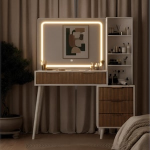 May include: A modern white vanity with a built-in illuminated mirror. The vanity features a light wood-toned drawer front and a matching three-drawer cabinet. A side shelf unit holds various beauty products, creating a functional and stylish space.