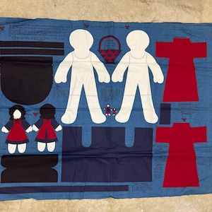 May include: A blue fabric panel with a sewing pattern for making a dress and two dolls. The pattern includes instructions for making a dress with a red bodice and a skirt, and two dolls with red dresses and black bonnets. The text on the panel reads "This is a very small sample of the pattern."