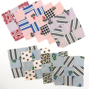 May include: Two sets of patchwork squares in various patterns and colors. The squares feature floral, striped, and gingham designs in red, pink, blue, black, and gray. The patchwork is arranged in a diagonal pattern.