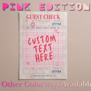 May include: A pink-themed guest check with the words "PINK EDITION" at the top. The check features a grid layout with fields for table, guest, and server information. The text "CUSTOM TEXT HERE" is prominently displayed. The check number is 077754.