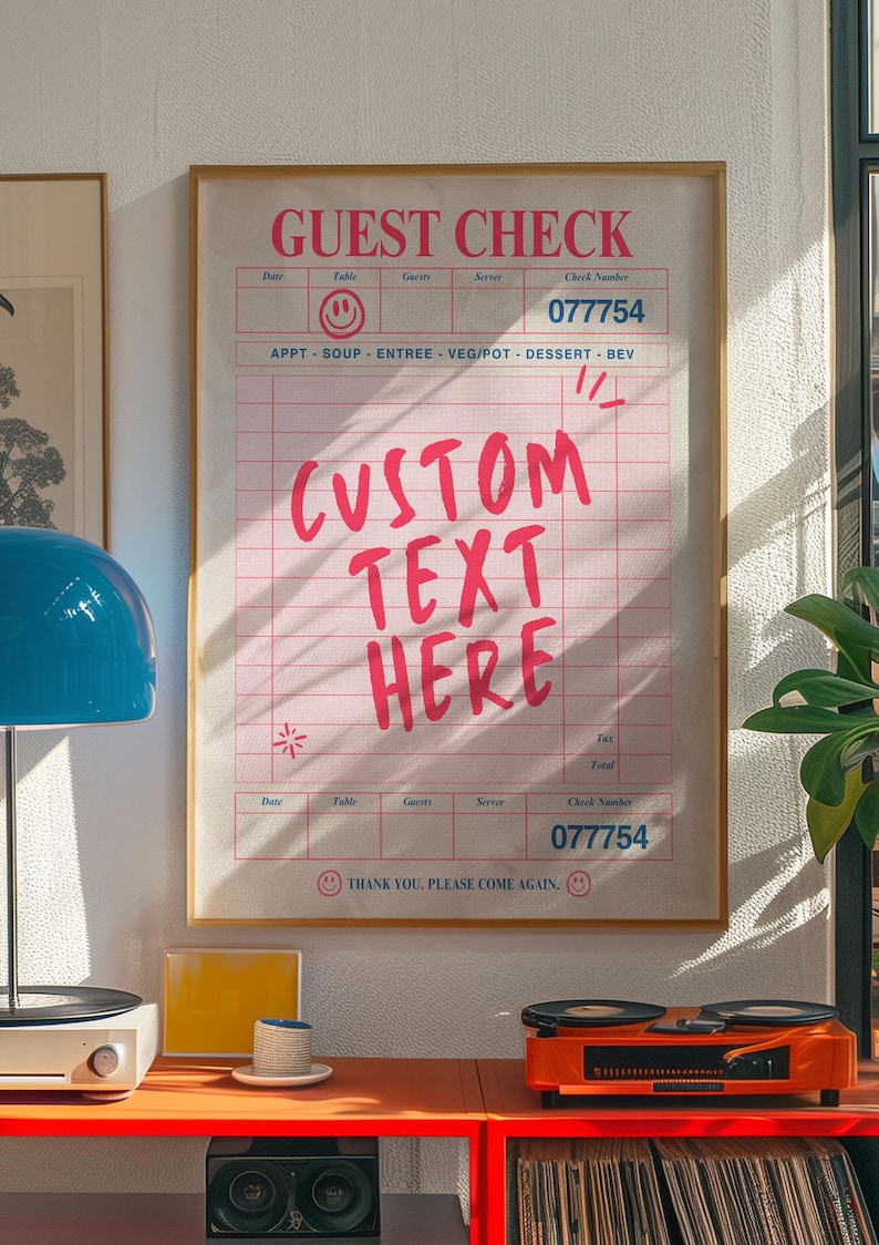 May include: A framed guest check with pink grid lines and text. The words "GUEST CHECK" and "CUSTOM TEXT HERE" are in pink. The check includes fields for date, table, guests, server, and check number. The check number is 077754.