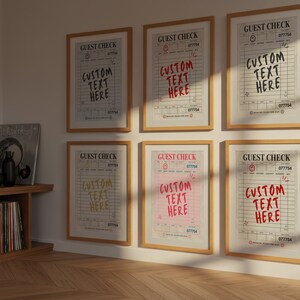 May include: Six framed prints of "Guest Check" designs with the text "Custom Text Here" in various colors. The prints are in wooden frames and are displayed on a light-colored wall. A wooden shelf with vinyl records and books is visible.