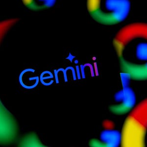 May include: A dark background features the word "Gemini" in blue and purple, with a star icon above it. The Google logo, in red, yellow, green, and blue, is blurred in the background, creating a modern, tech-focused design.