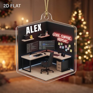 May include: A flat, hexagonal acrylic ornament featuring a miniature office scene with a desk, computer monitors, a chair, and a neon sign reading CODE. COFFEE. REPEAT. The name ALEX is printed in white above the desk, which includes a yellow duck.