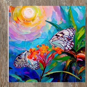 May include: An oil painting featuring two butterflies with white and black patterned wings resting on a cluster of vibrant orange flowers. The background displays a swirling, textured sunburst in shades of yellow, pink, and blue, with green foliage.