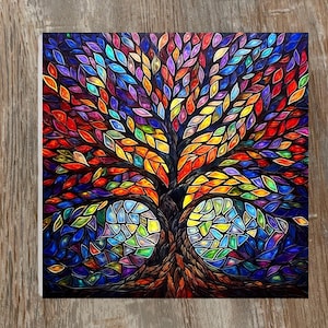 May include: A vibrant, square artwork depicting a tree with a mosaic-like design. The tree's leaves are a spectrum of colors, including red, orange, yellow, green, blue, and purple. The trunk and roots are brown, and the background is dark blue.