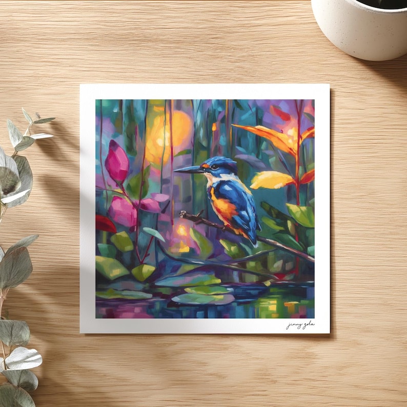 May include: A vibrant painting of a kingfisher bird perched on a branch, set against a colorful backdrop of foliage and water. The bird features blue, orange, and white plumage. The artwork has a signature in the bottom right corner.