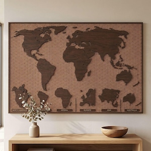 May include: A wooden world map wall art piece. The map is a dark brown color, with continents cut out and mounted on a patterned background. The continents are labeled with the names of the continents. The frame is dark brown.