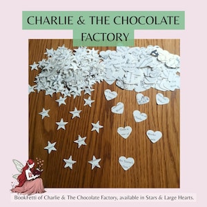 May include: A collection of paper confetti cutouts made from pages of the book Charlie and the Chocolate Factory. The set includes numerous small white stars and heart-shaped pieces, each featuring printed black text from the story.