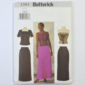 May include: Butterick sewing pattern 3304 for sizes 8-10-12. The envelope displays illustrations of a short-sleeved top, a strapless top, and a long skirt, alongside a photograph of a person wearing a sleeveless patterned top and a long pink skirt.