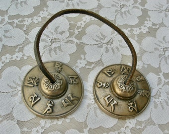 Authentic Tibetan Tingsha Brass Cymbals, sturdy leather cord, Tibetan Buddhist symbols, 2 3/4", excellent vintage condition