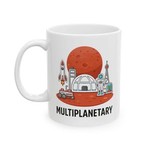 May include: White ceramic mug with a colorful illustration of a rocket, rover, astronaut, and a planet. The word "MULTIPLANETARY" is printed in black at the bottom of the design. The mug has a white handle.