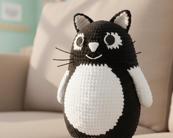 ローソーたぬきかぎ針編みパターン |たぬきの尾を持つ座っているタヌキ