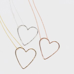 Our design is delightfully asymmetrical, just like being swept off your feet. The bold 1.75 X 1.75 inch heart pendant is wire wrapped to our barely there 1.1mm chain. You have the choice of 3 fine metal styles for your heart necklace as shown here.
