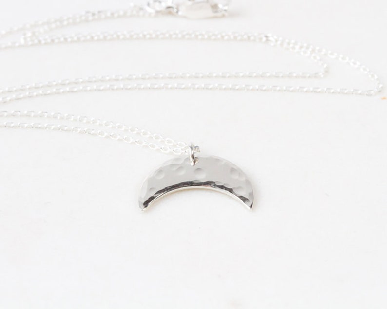 Image shows style A in fine sterling silver with delicate hand hammer texture that glints and gleams in the sunshine. The perfect necklace for layering, our celestial sisterhood necklaces can be worn every day without change.