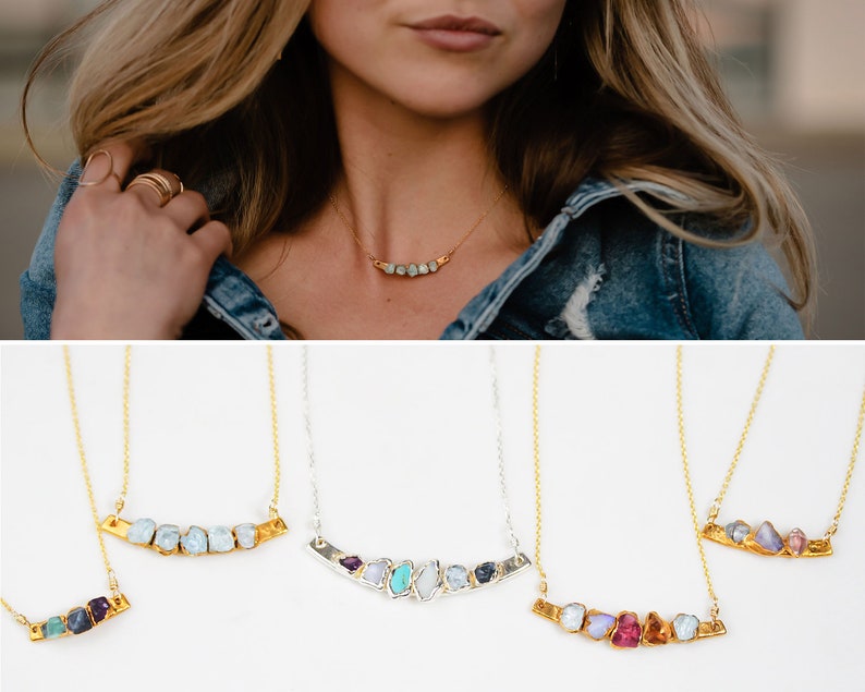 Images shows what the our mothers birthstone necklace looks like on a model with samples of different metals and numbers of stones. Raw, organic, personalized, these necklaces are totally unique and custom and make the best personalized mom gift.