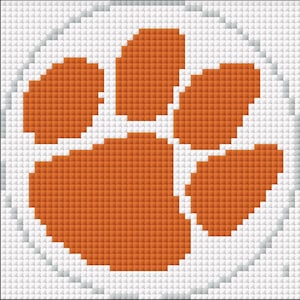May include: An orange paw print design on a white background. The paw print is made up of small squares, and the design is surrounded by a white border. The image is a graphic representation of a paw print.