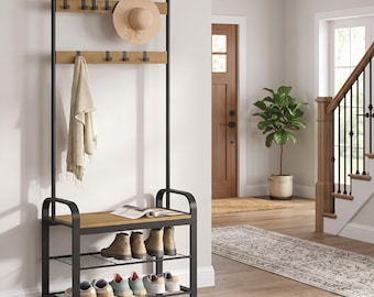 May include: A tall hall tree featuring a black metal frame with two horizontal light brown wood panels, each equipped with black hooks. The unit includes a bench seat, two wire shelves for footwear, and a top bar for hanging items.