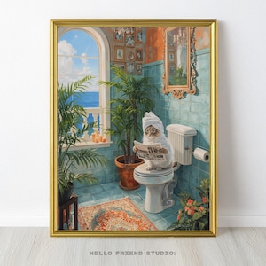 May include: A framed print depicts a cat wearing a towel on its head, reading a newspaper while seated on a toilet. The bathroom scene includes a window with a view of the ocean, potted plants, and a decorative mirror. The artwork is in a gold frame.