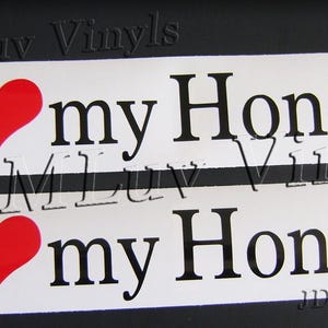 May include: Two white vinyl decals with the text "I ❤️ my Honda." The word "I" and "my" are in black, with a red heart symbol between them. The word "Honda" is in black.