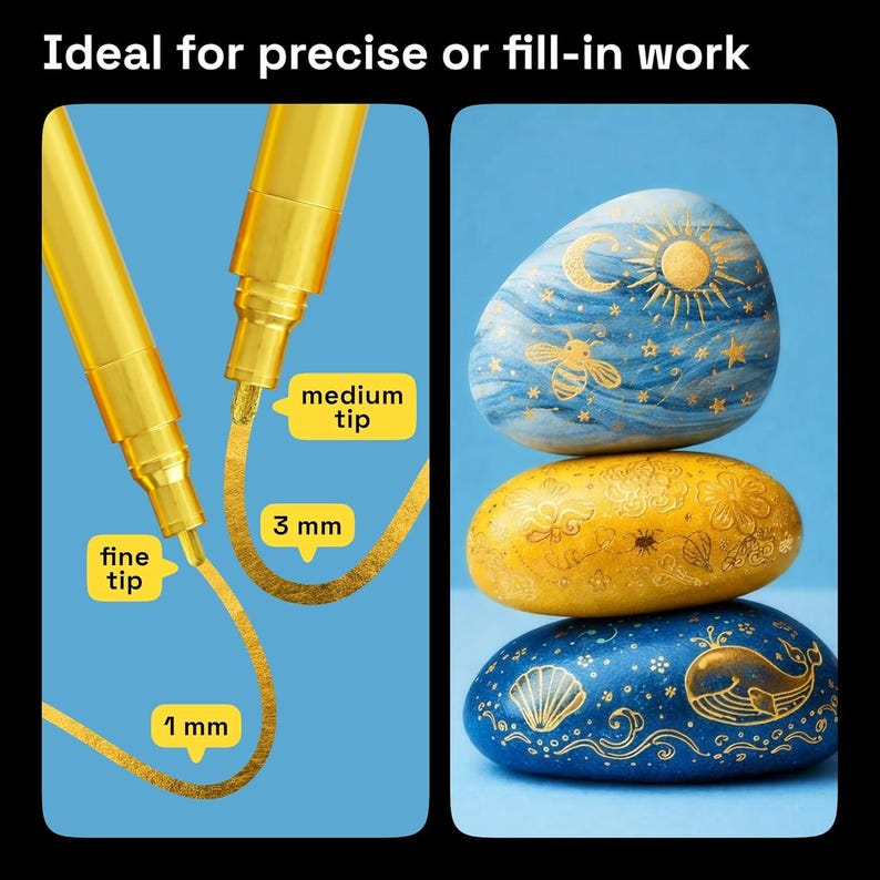 May include: Two gold metallic markers with fine and medium tips, creating 1 mm and 3 mm lines, respectively. The image also shows three painted stones in blue, yellow, and blue, with celestial and marine designs. The text reads "Ideal for precise or fill-in work."
