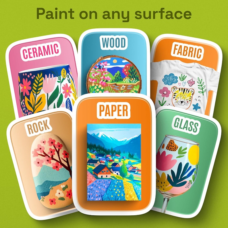 May include: Image showcasing various painted surfaces: ceramic mug, wood slice, fabric t-shirt, rock, paper art, and glass. Each surface features colorful artwork, including floral designs, landscapes, and a tiger illustration. The text "Paint on any surface" is at the top.