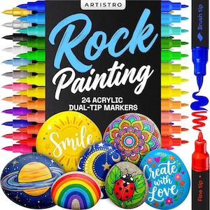 May include: A set of 24 dual-tip acrylic markers for rock painting, with a variety of colors. The box features the text "Rock Painting" and examples of painted rocks with designs like a rainbow, ladybug, and planets. The markers have both brush and fine tips.