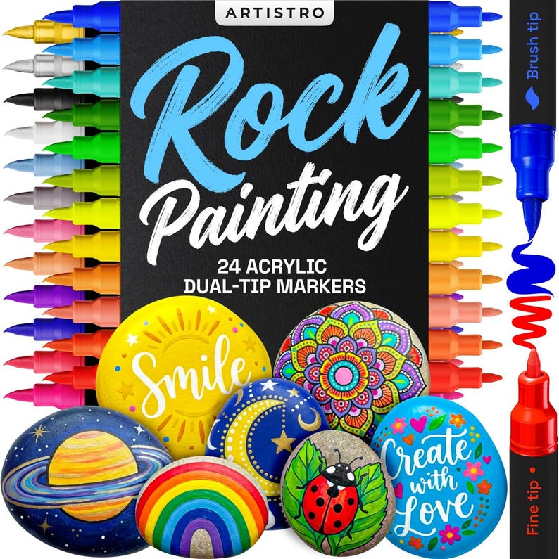 May include: A set of 24 dual-tip acrylic markers for rock painting, with a variety of colors. The box features the text "Rock Painting" and examples of painted rocks with designs like a rainbow, ladybug, and planets. The markers have both brush and fine tips.