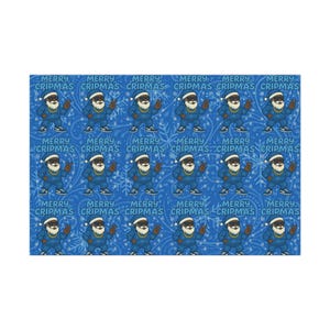 May include: A repeating pattern featuring a cartoon character dressed as Santa Claus, with a blue outfit, white beard, and a gold chain. The text "MERRY CRIPMAS" is repeated throughout the design, set against a blue background.