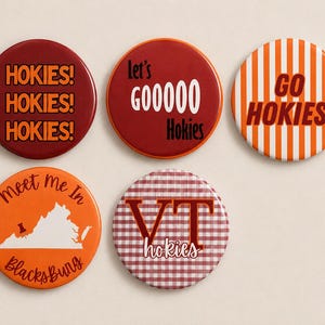 May include: Five circular pinback buttons featuring maroon and orange designs. One says HOKIES! three times, another says Let's GOOOOO Hokies, one has orange and white stripes with GO HOKIES!, one shows a map with Meet Me In Blacksburg, and one has VT hokies.