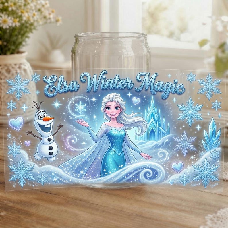 May include: A clear glass tumbler featuring a wrap-around design of a blonde character in a blue dress, a snowman, and an ice castle. The text Elsa Winter Magic is printed in blue script. The design includes blue snowflakes, hearts, and swirls.