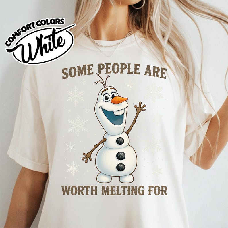 May include: White Comfort Colors t-shirt with the text "SOME PEOPLE ARE WORTH MELTING FOR" and a cartoon snowman character. The snowman has a carrot nose, twig arms, and three black buttons. Snowflake graphics are also present.