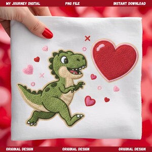May include: White fabric with an embroidered design featuring a green dinosaur, red heart, and pink hearts. The dinosaur is running with a smiling expression. The text "MY JOURNEY DIGITAL" is at the top.