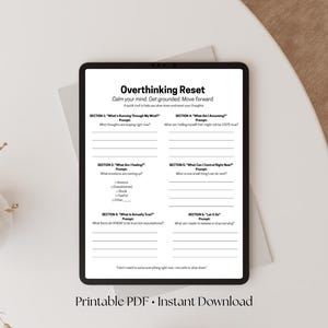 May include: A digital tablet displaying a self-help worksheet titled "Overthinking Reset." The worksheet includes prompts to calm the mind and move forward. Text at the bottom reads "Printable PDF • Instant Download."