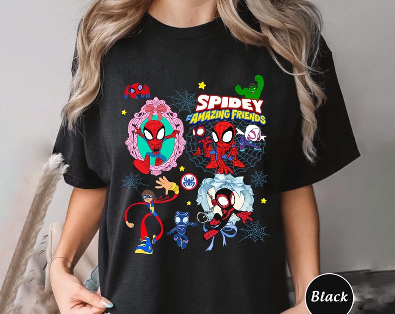May include: Black t-shirt featuring a colorful graphic of Spider-Man and friends. The design includes the text "Spidey and His Amazing Friends" with various characters and spiderwebs. The shirt is a comfortable fit.