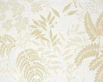 May include: A wallpaper featuring a repeating botanical pattern of ferns and various leaves in shades of cream, beige, and off-white. The design has a textured appearance with overlapping foliage elements arranged across the entire surface area.