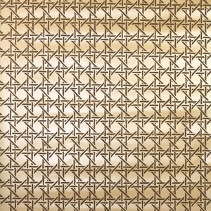 May include: A repeating pattern of dark brown woven cane on a light beige background. The design features a series of intersecting lines forming a grid-like structure, creating a textured surface. This pattern is often used in furniture and decor.
