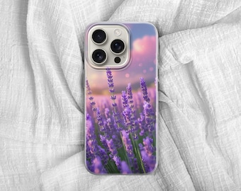 May include: A phone case featuring a vibrant lavender field design. The case showcases a close-up of purple lavender flowers with a soft, blurred background of pink and blue hues. The case is set against a white fabric.