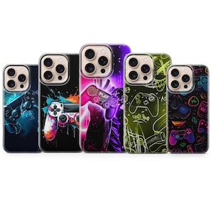 May include: A collection of five phone cases with gaming-themed designs. The cases feature colorful graphics of game controllers, neon lights, and abstract art. The cases are designed to fit a smartphone.
