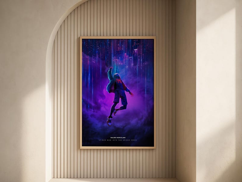 May include: A framed poster featuring a dynamic illustration of a character in mid-air against a backdrop of a cityscape with purple and blue hues. The poster has a wooden frame and the text "Miles Morales" and "Spider-Man Into the Spider-Verse".