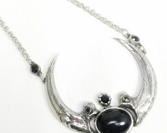 Harpy Eagle Claw Necklace with black glass. DCN