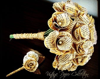 May include: A bouquet of paper flowers made from vintage book pages. The flowers are tied together with twine and decorated with small pearl accents.