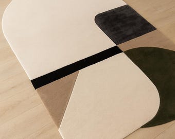 Alfombra moderna de mediados de siglo hecha a mano, con estampado geométrico en tonos crema y marrón.