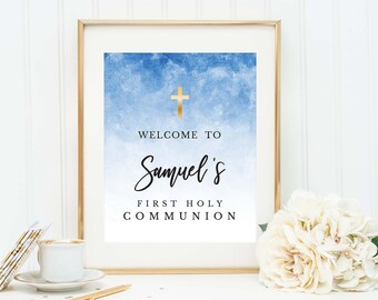 May include: A blue and gold watercolour sign with a gold cross and the text "Welcome to Samuel's First Holy Communion".