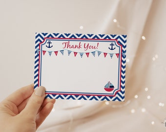 May include: A white thank you card with a red and blue chevron border. The card has a red and blue banner with anchors and the text "Thank You!" printed on it.