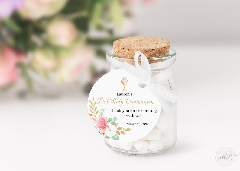 May include: White round favor tag with gold floral design and a gold chalice icon. The tag says "Lauren's First Holy Communion" and "Thank you for celebrating with us! May 12, 2020".