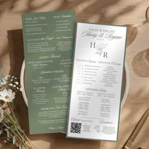 May include: Two wedding menu cards with text in a light green and white color scheme. The cards are on a white plate with a floral arrangement and a gold-colored pen. The text includes the names "Harry & Regina".