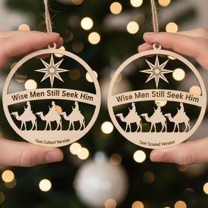 May include: Two wooden Christmas ornaments with a circular design. Each ornament features a star, the text "Wise Men Still Seek Him", and silhouettes of three figures riding camels. One is labeled "Text Cutout Version" and the other "Text Scored Version".