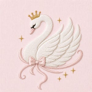 May include: An embroidered design on a light pink fabric featuring a white swan wearing a gold crown. The swan is accented with a light pink bow at the base and surrounded by several small, four-pointed gold stars stitched into the fabric.